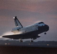 [ a space shuttle (touching down) ]